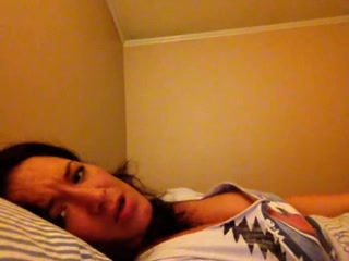 Raunchy babe exposing her juggs on camera and fucks with a dildo