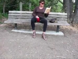 Lovely crossdresser jerks it on a park bench