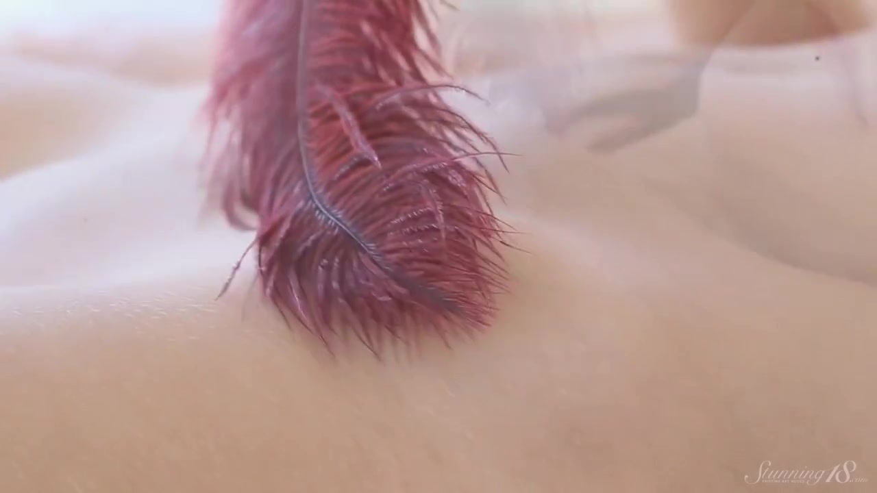 Coed Susan Strokes Her Body And Pussy With Red Feathers!