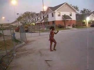 Curly black slut walks naked around the neighborhood