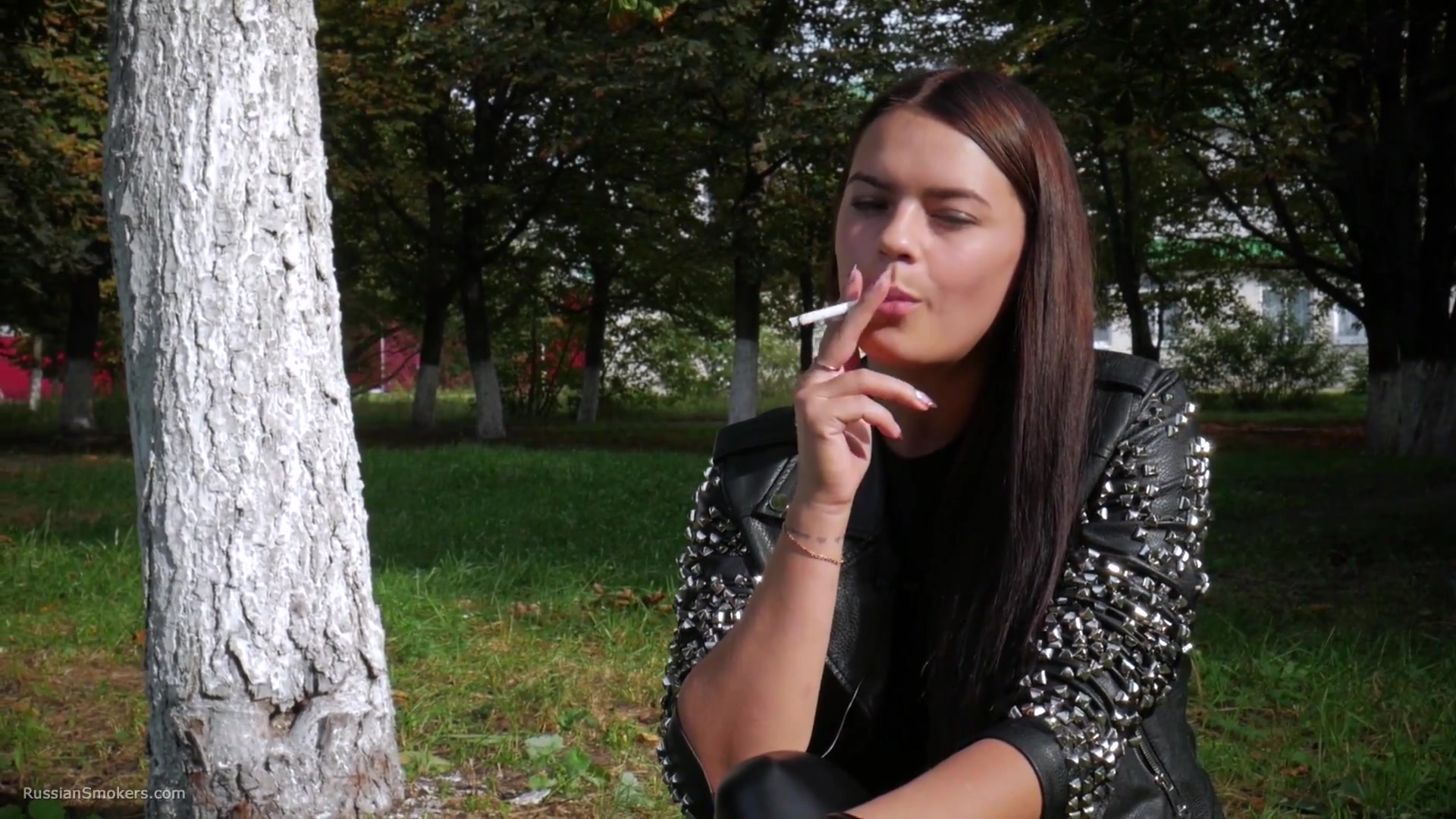 Pretty Faced Asya Is Smoking A Cigarette Outdoors