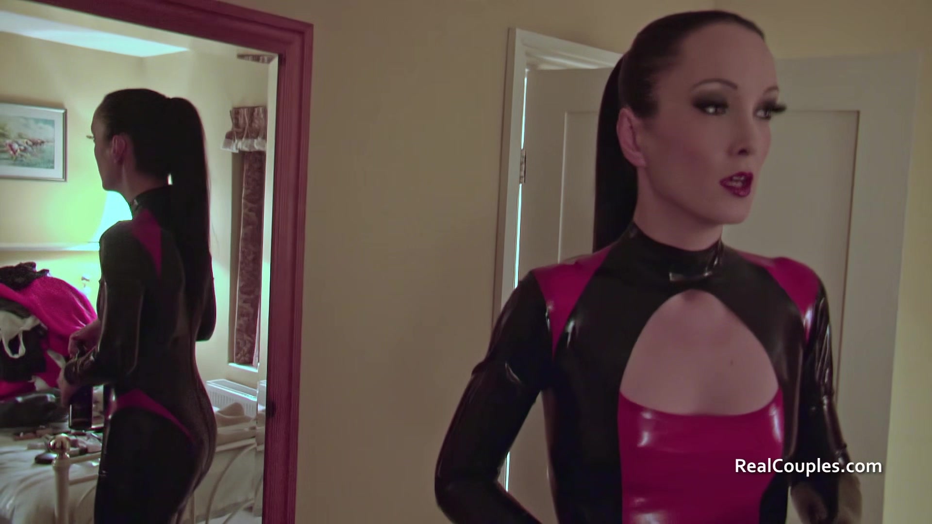 Cross dressing husband with PVC clad wife