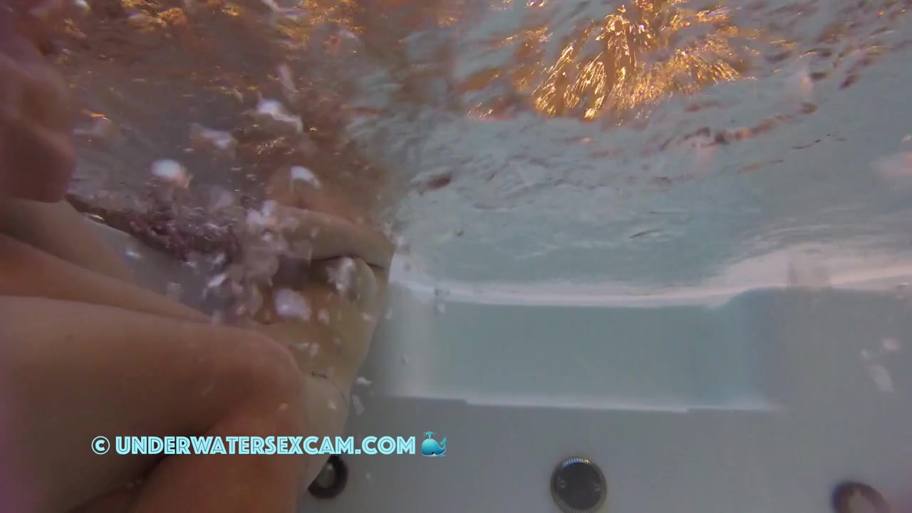 This Beautiful Couple Relaxes In The Hot Tub Of A Public Nudist Resort
