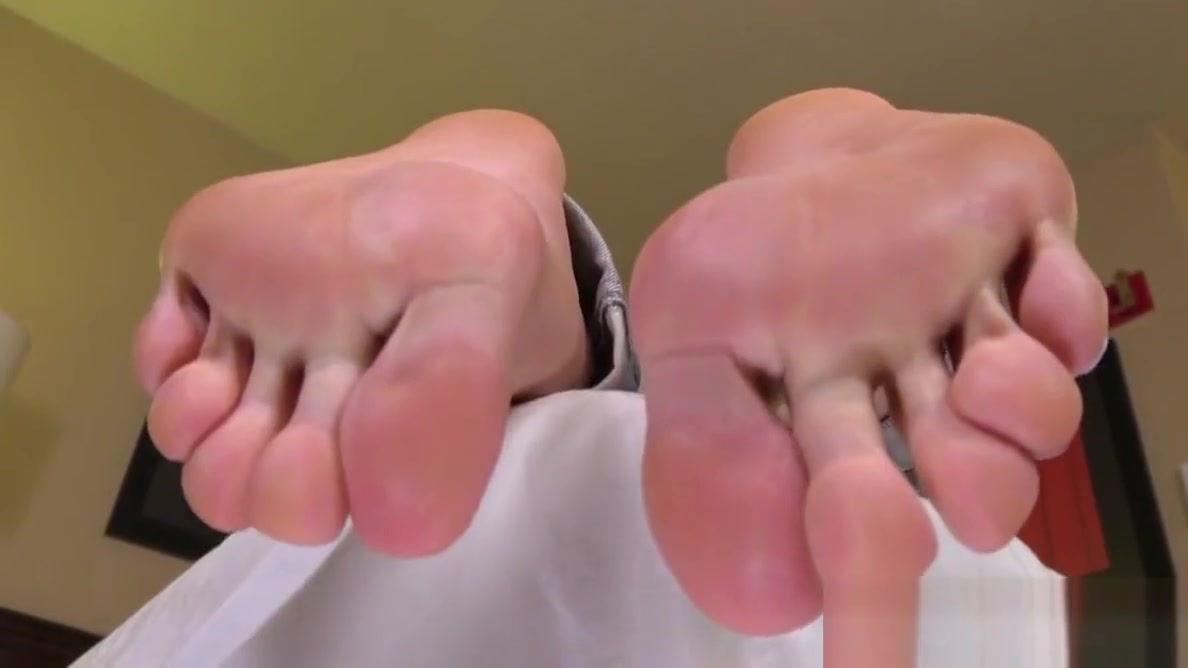 Pedicured redhead trans showing off her soles