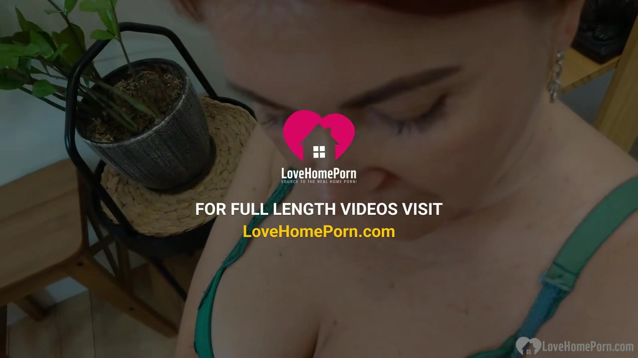 Redhead mature sucks while on her knees