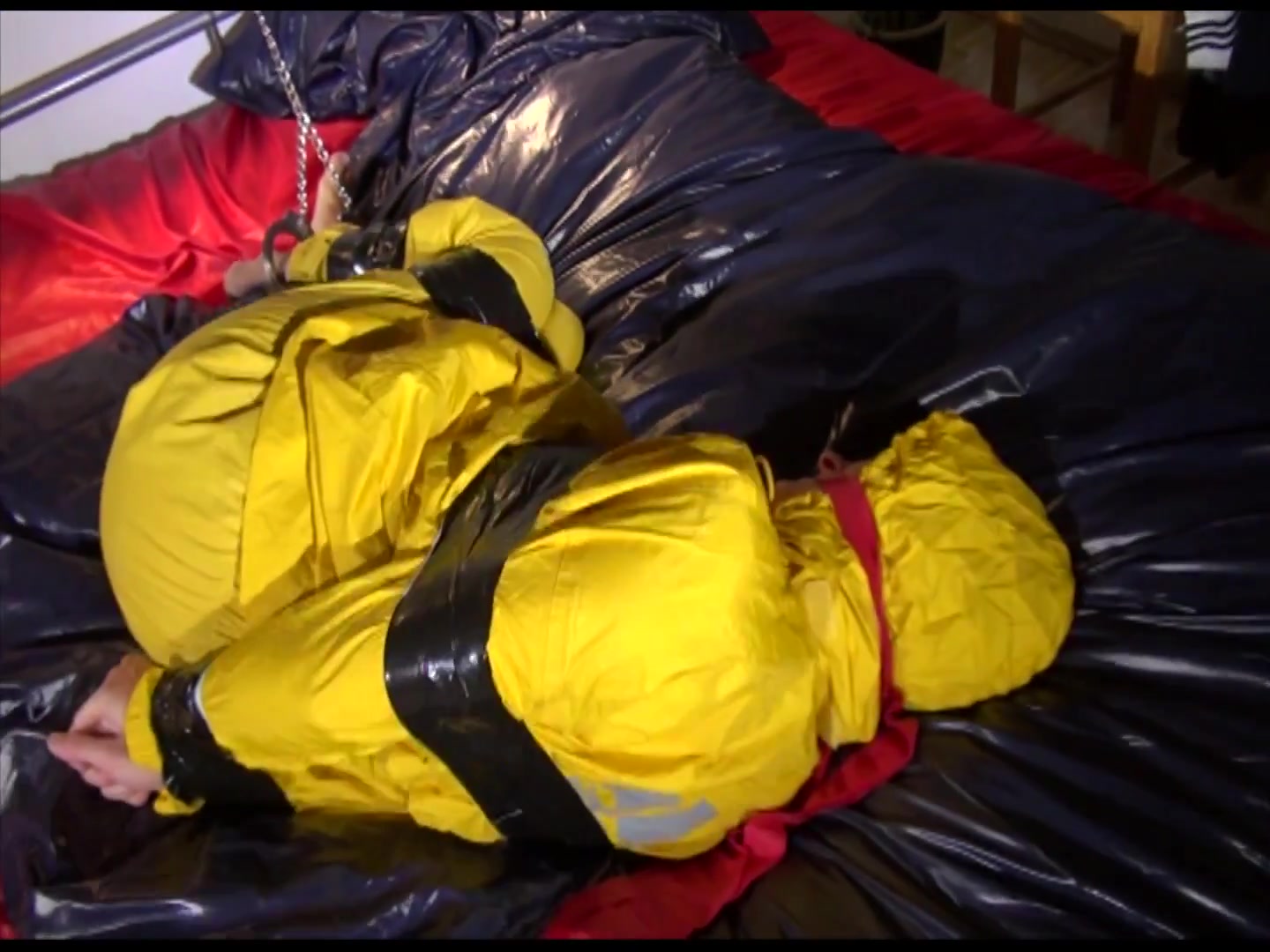 Get 2 Archivevideos With Sonja Enjoying Bondage In Her Shiny Nylon Rainwear