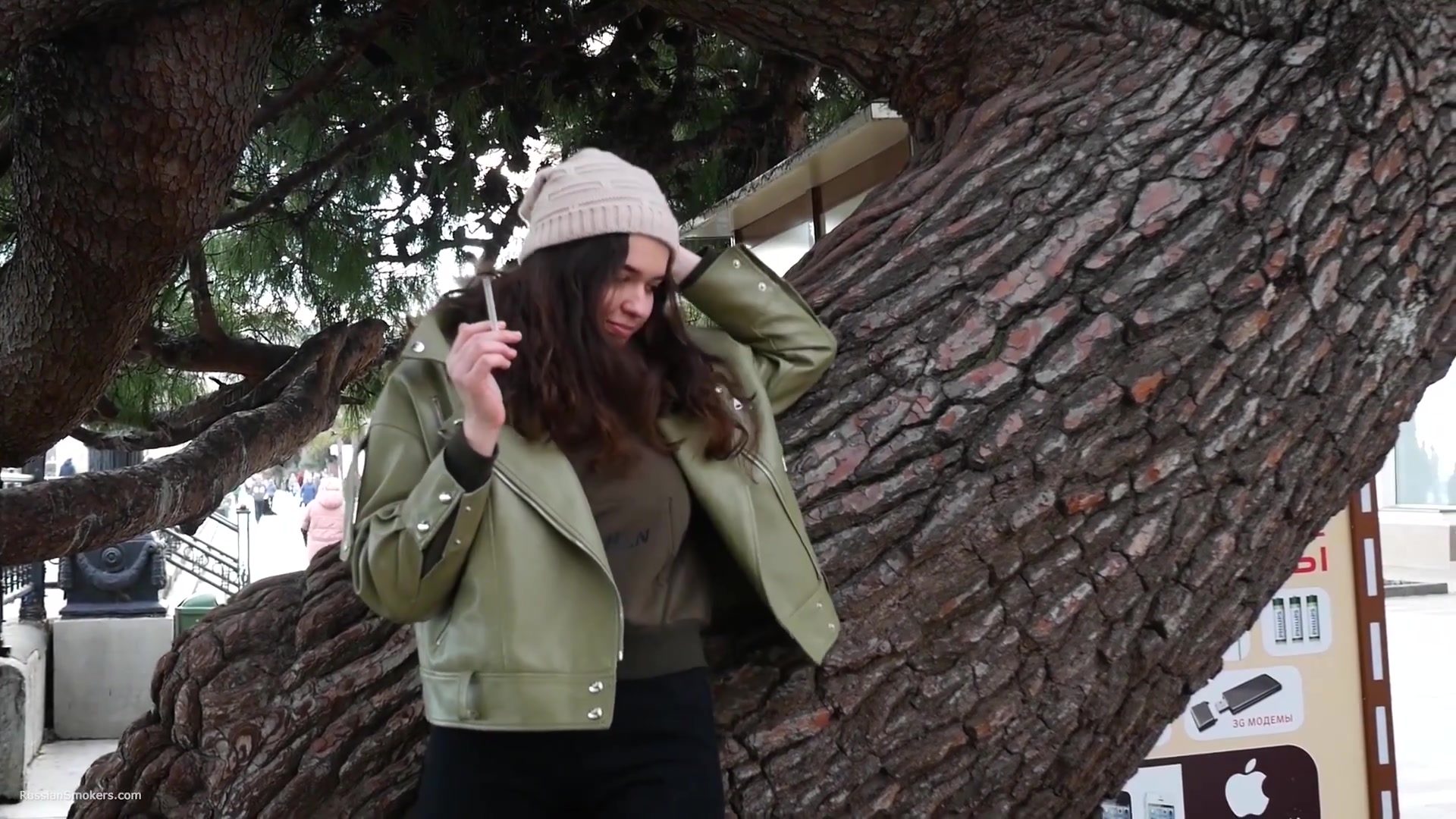 Young Brunette Is Taking An Unhurried Stroll With Allwhite 120mm Cigarette