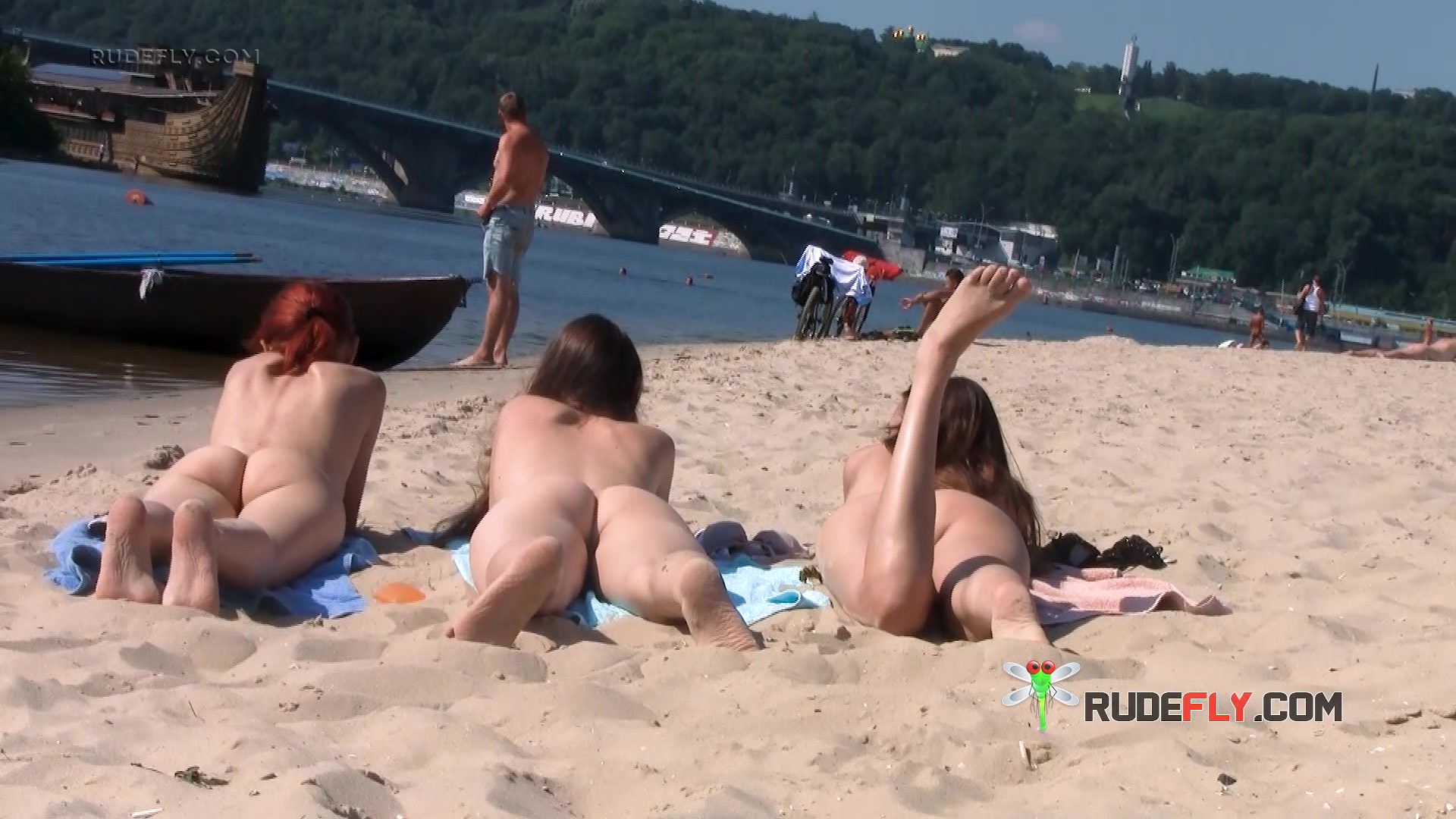 Wicked young nudist enjoys being topless at the beach