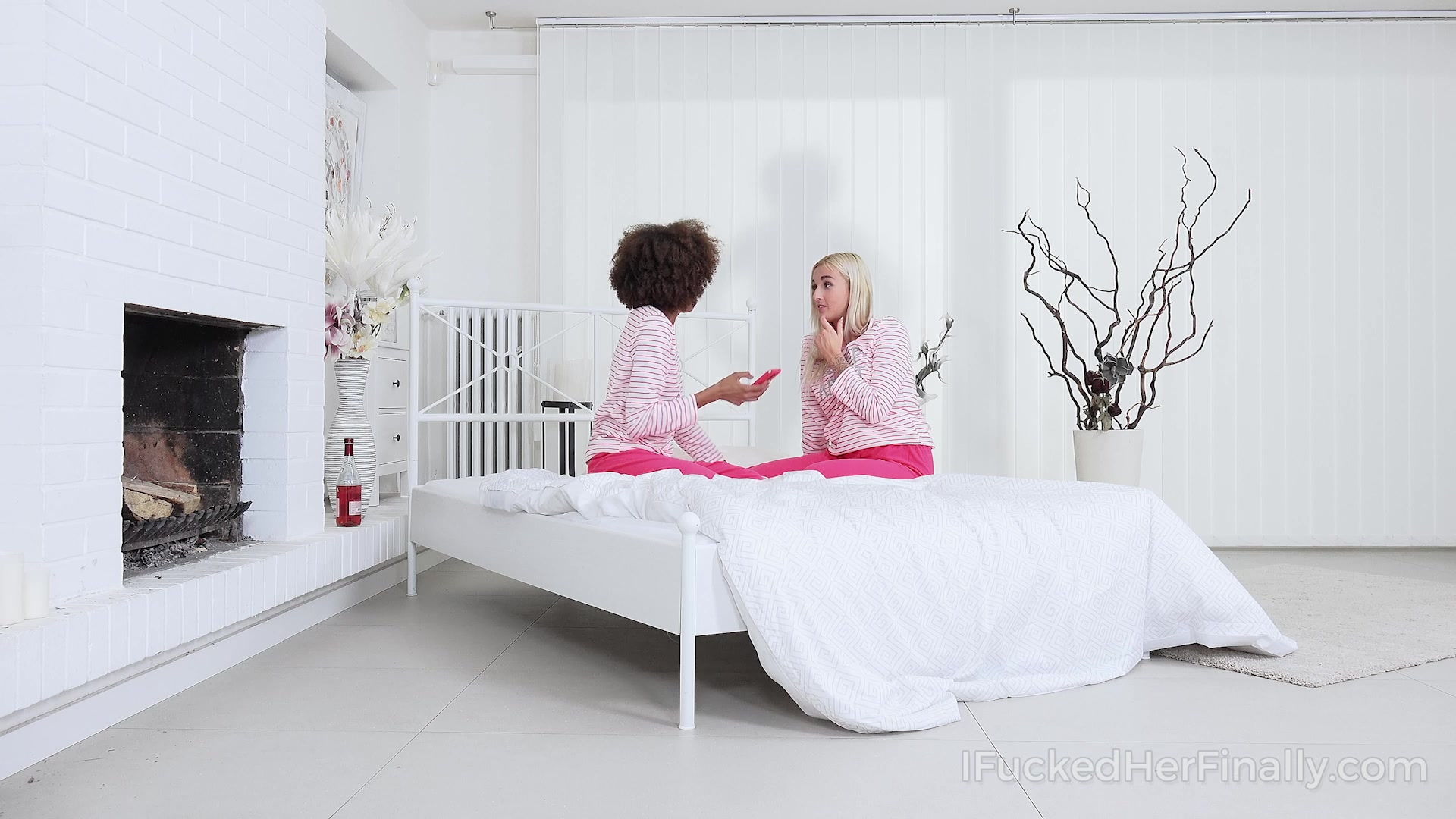 Playful girlfriends spend time playing games in bed