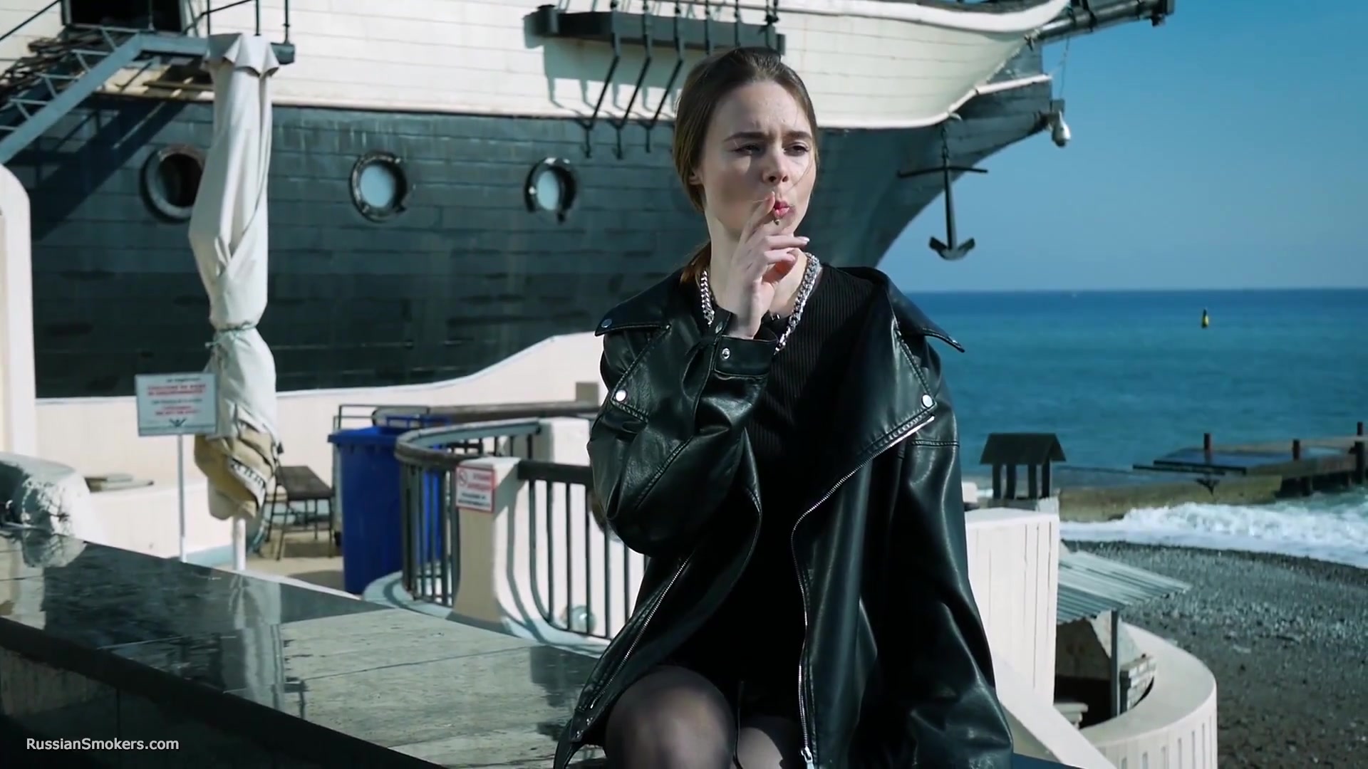 Smoking Strong Brown 120mm Cigarette Near The Beach