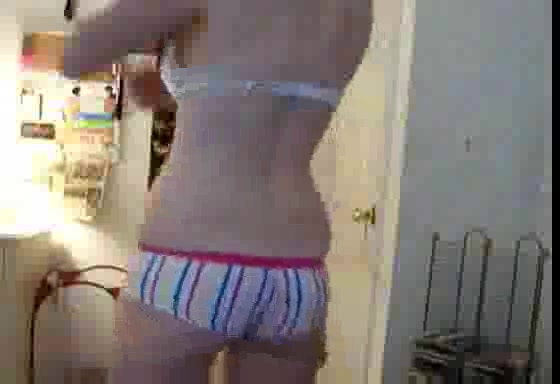 Pussycat poses in front of the webcam in stripped undies