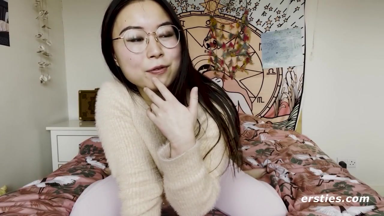 Cute Babe From China Rubs Her Shaved Pussy Before Grabbing A Dildo