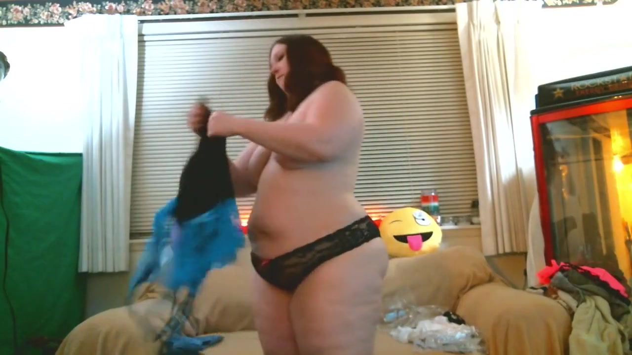 thick redhead tries on some clothes and shows off her ass and tight pussy