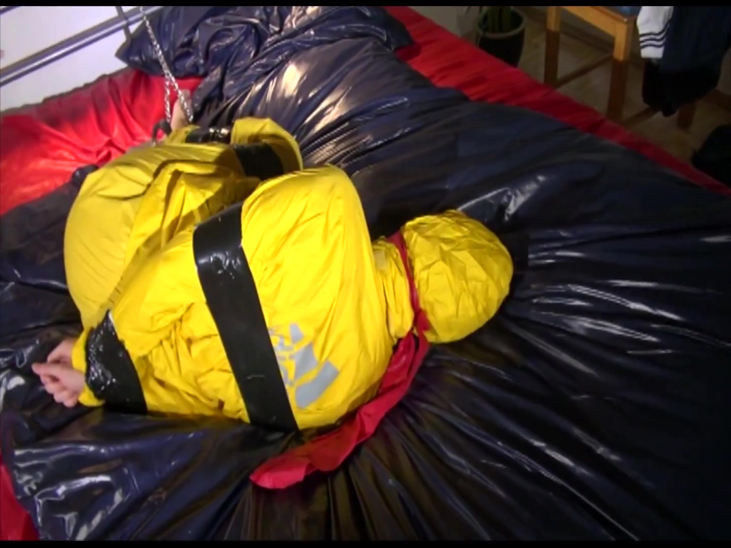 Get 2 Archivevideos With Sonja Enjoying Bondage In Her Shiny Nylon Rainwear