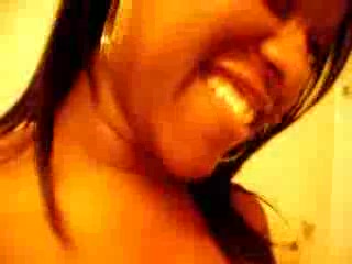 Ebony shoots her fine pussy in front of the mirror