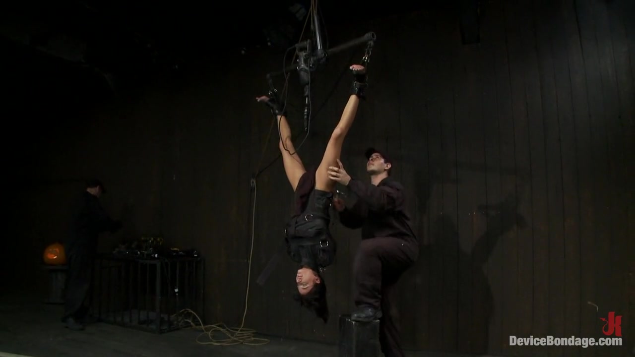 Bound in a straightjacket, inverted suspendedFucked by a machine, made to suck cock & zippered.