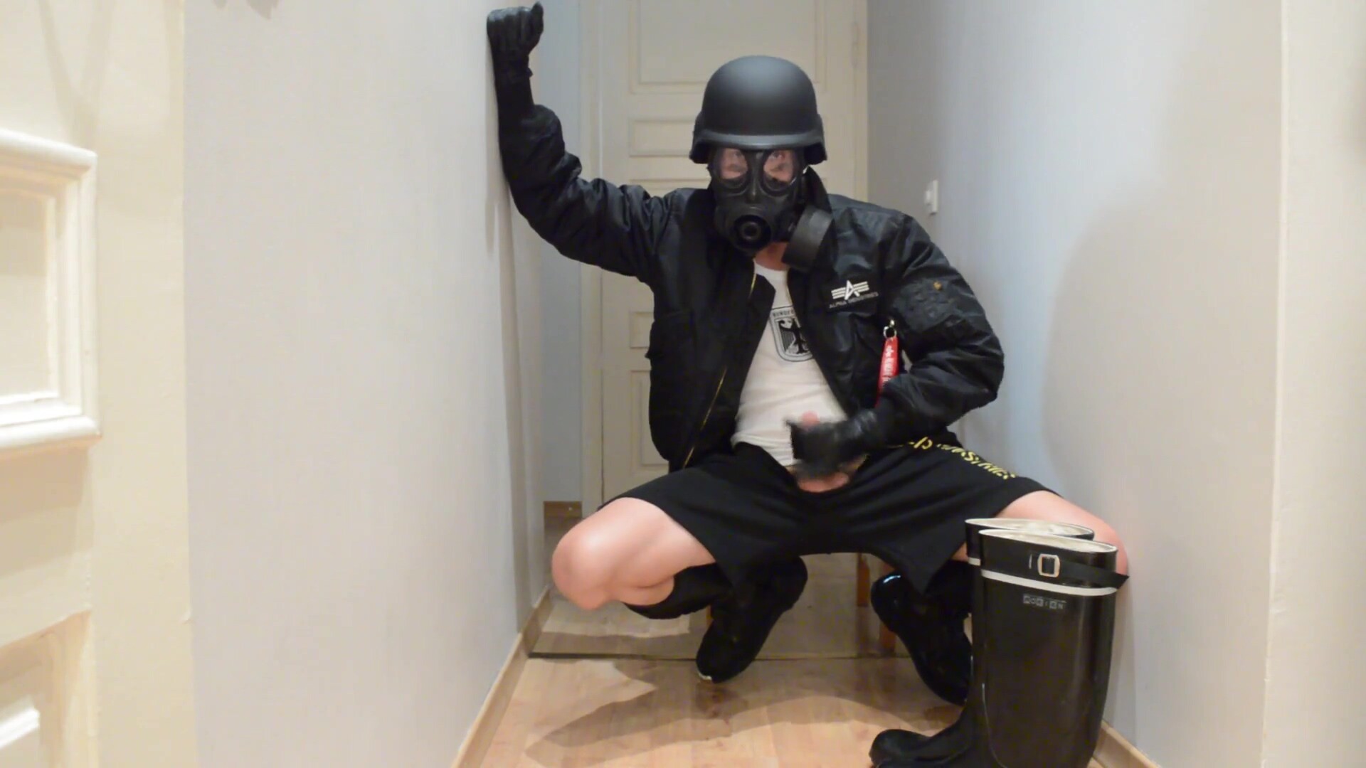 Gas masked guy cums on his rubber boots