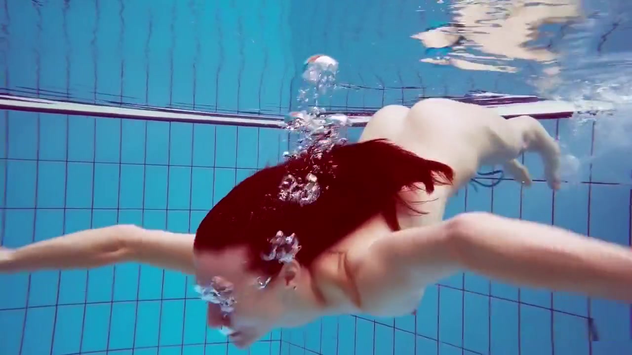 Redhead In Blue Bikini Showing Her Body
