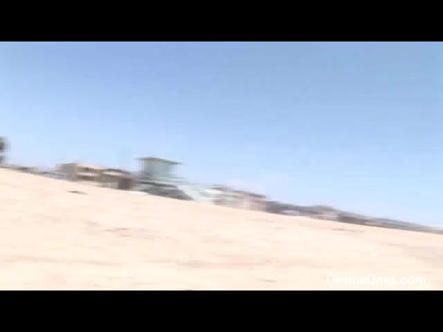 April O'Neal flashes at the beach - Devineones