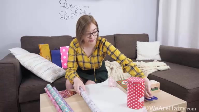 Abby masturbates after wrapping her gifts