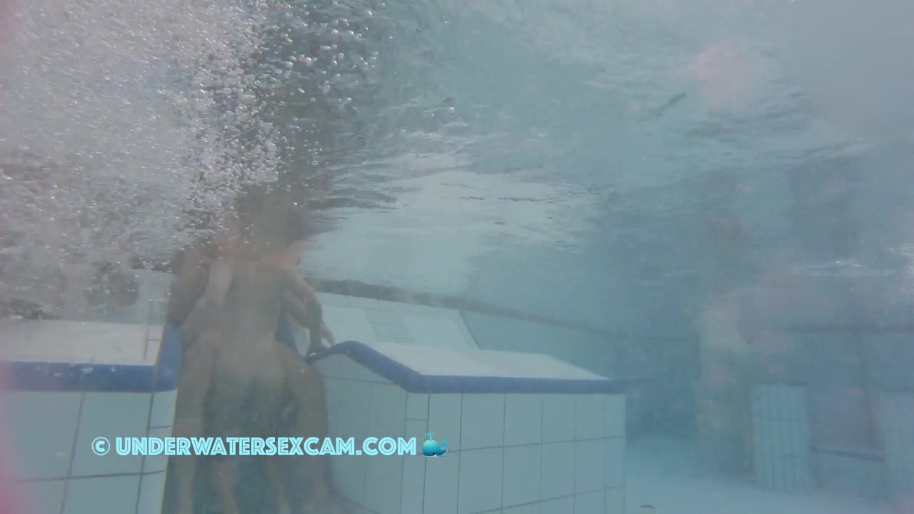This Young Couple Plays Together Underwater In Front Of Many People