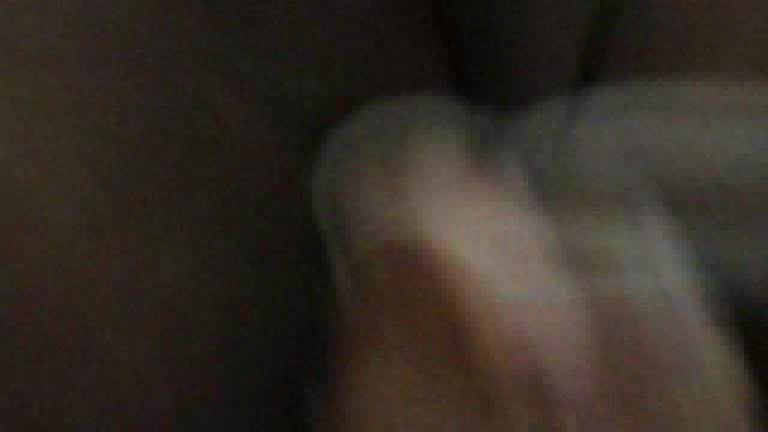 Black skinned girl has something inside her pussy