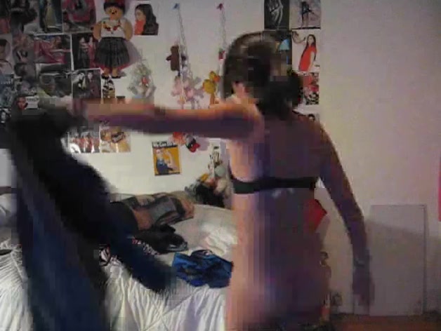 Skinny Asian chick strip dancing in front of the webcam