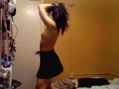 Young Japanese babe dancing striptease on camera