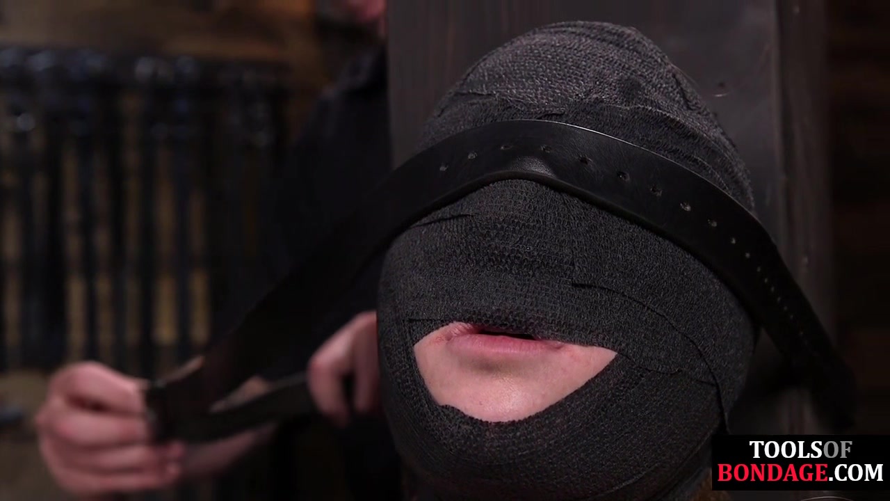 Gagged submissive clamped and caned while bound by master