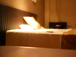 Homemade amateur camera shooting a couple having fun in bedroom