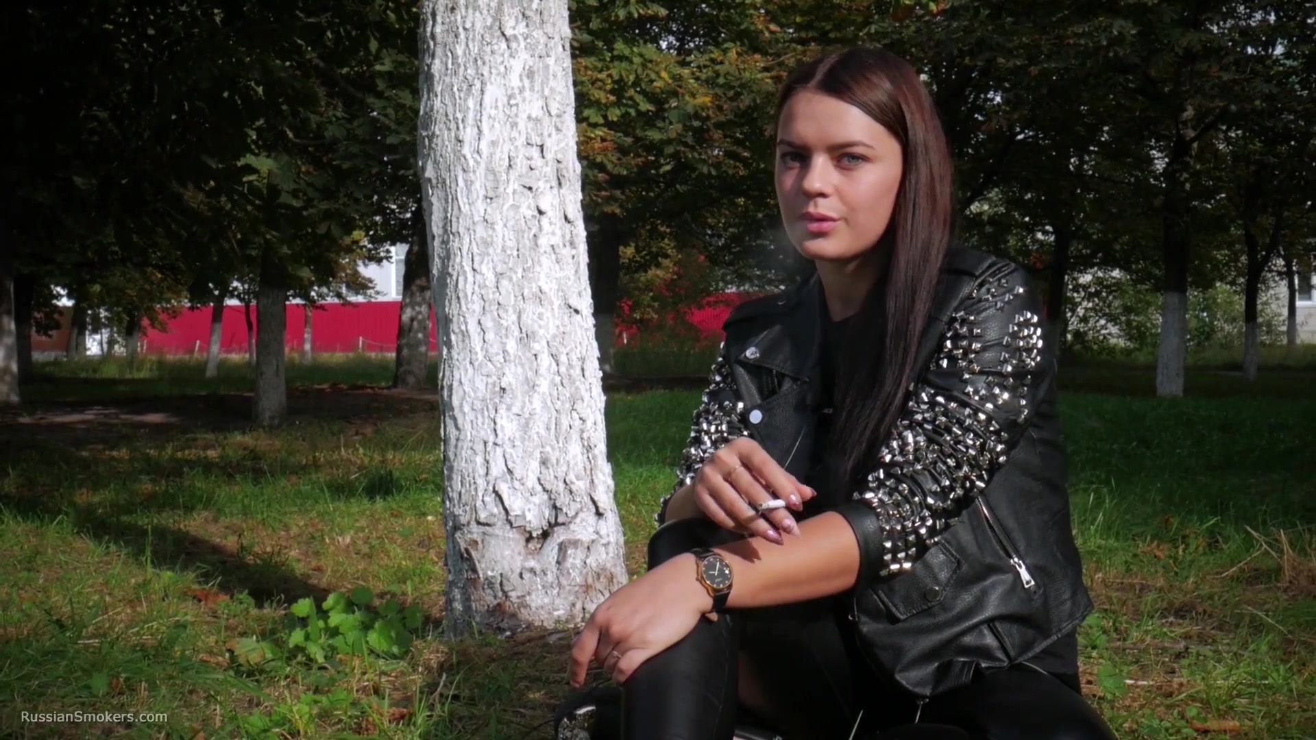 Pretty Faced Asya Is Smoking A Cigarette Outdoors