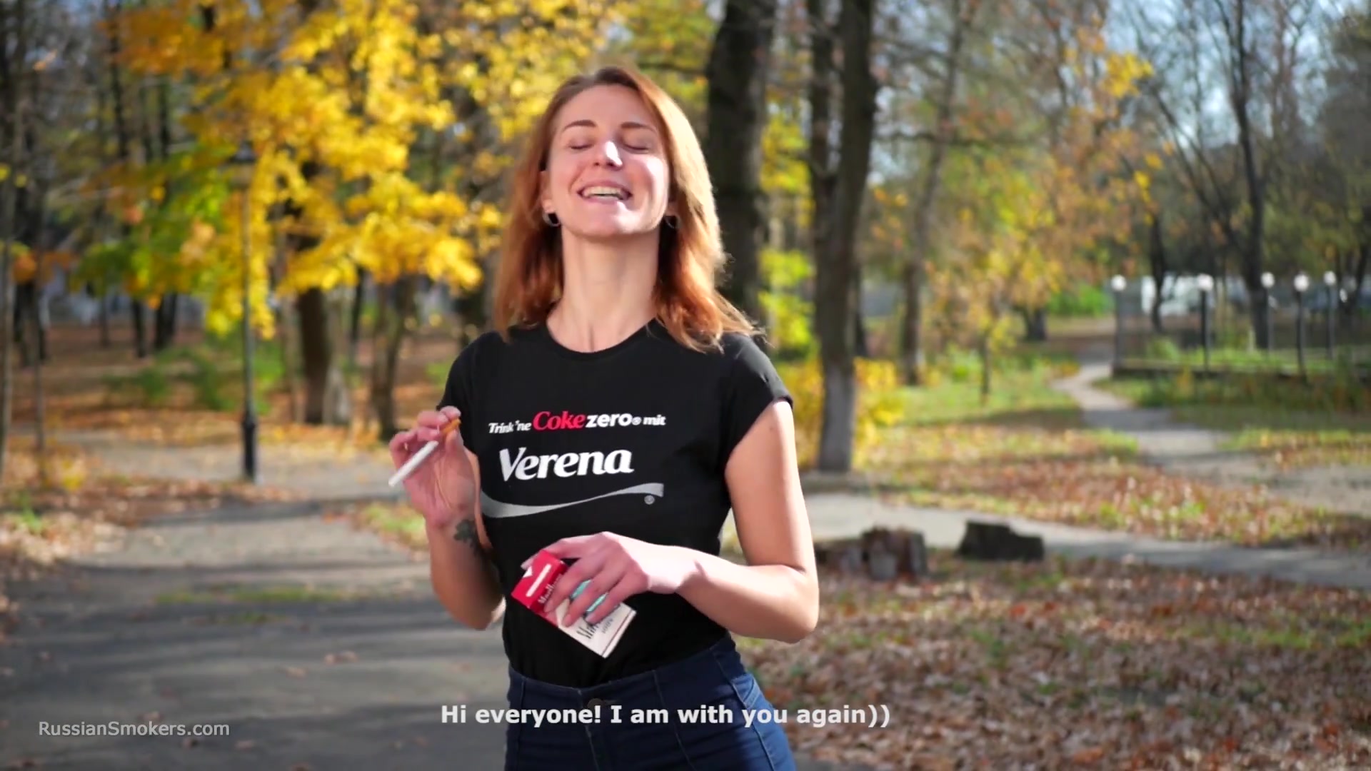 Sasha Is Smoking Two Cigarettes One By One In The Autumn Park