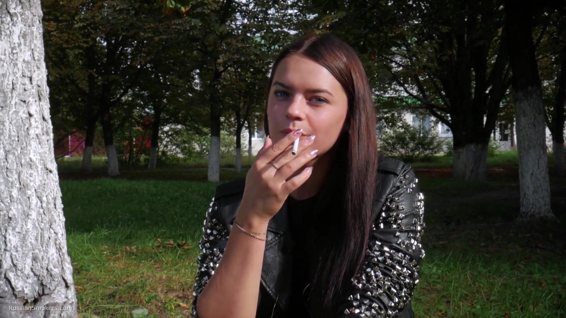 Pretty Faced Asya Is Smoking A Cigarette Outdoors