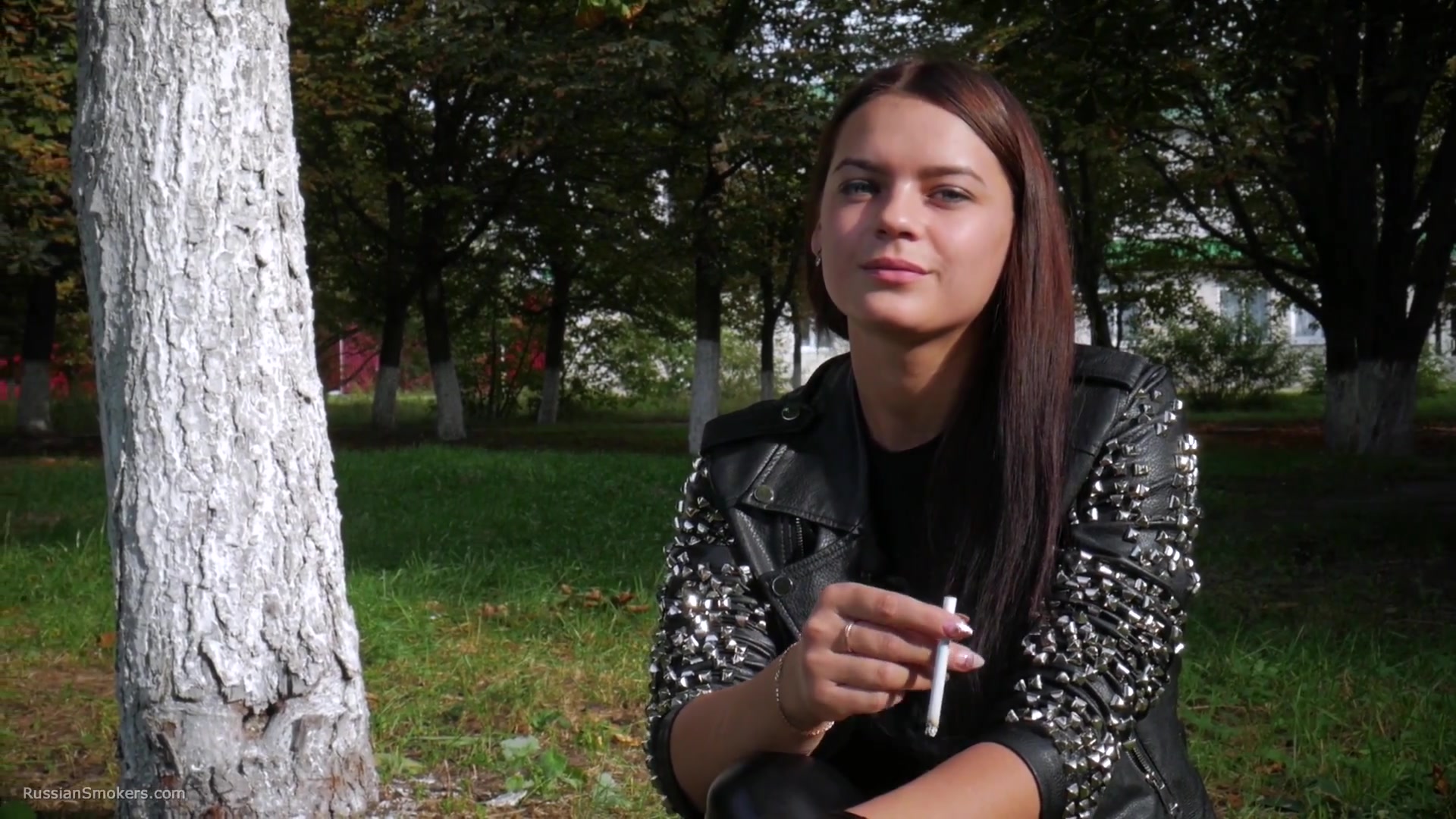Pretty Faced Asya Is Smoking A Cigarette Outdoors