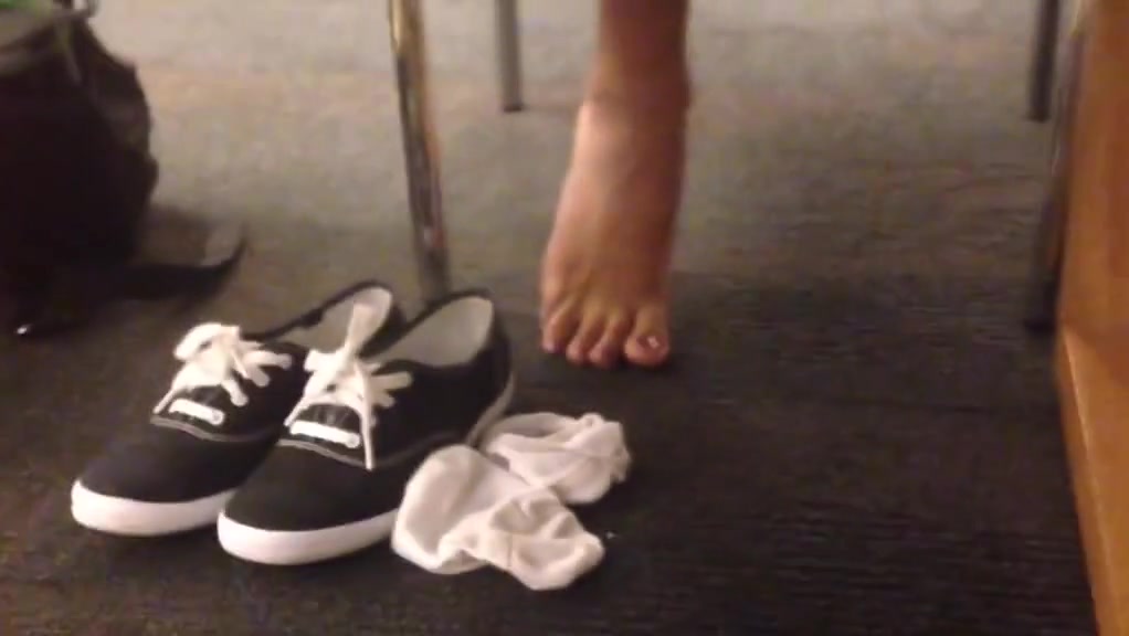 Candid sexy indian feet socks off at library