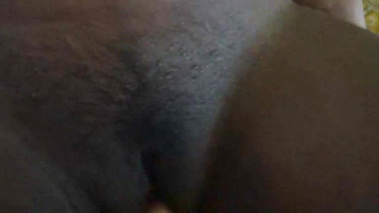 Black skinned girl has something inside her pussy