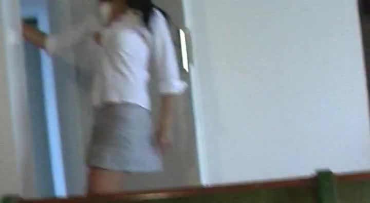 Horny tanned brunette in school outfit doing lapdance