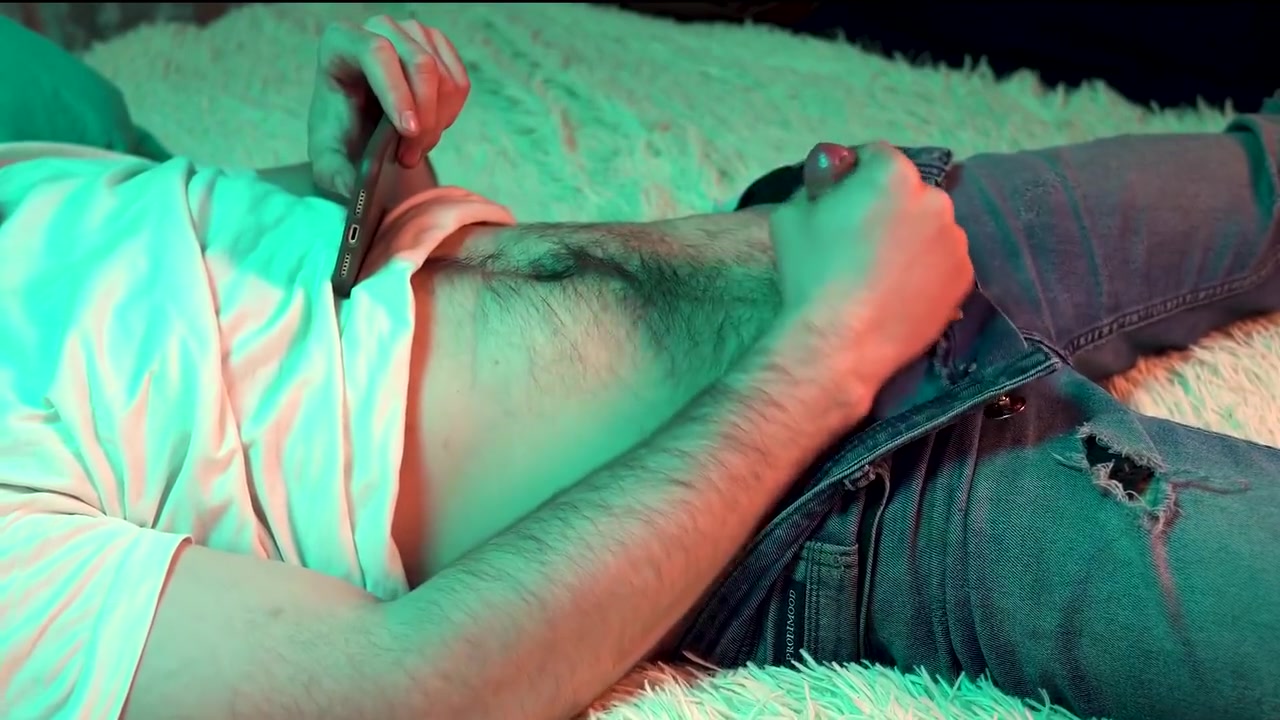 A Young Hot Guy Watches Porn On His Phone And Jerks Off His Small Cock