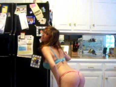Young busty chick strips in the kitchen, where she belongs