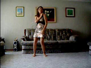 Hot Latina strip-dancing and demonstrating her body