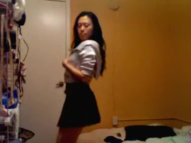 Young Japanese babe dancing striptease on camera