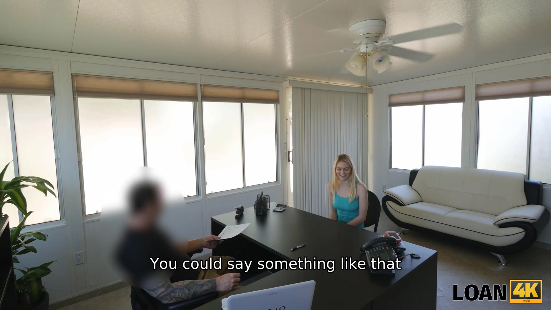 LOAN4K. Dancer shows the bank manager how well she can move her body