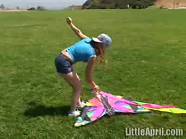 Cute Little April Outdoors Sucking A Popsicle