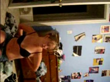 Blonde young girl taking her clothes off slowly