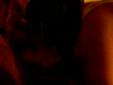 Two ebony lezzies making out on a bed