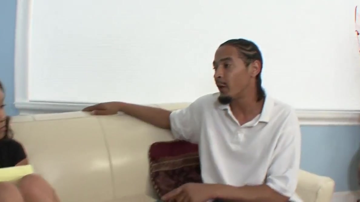 Cute black girl blows black cock on the sofa