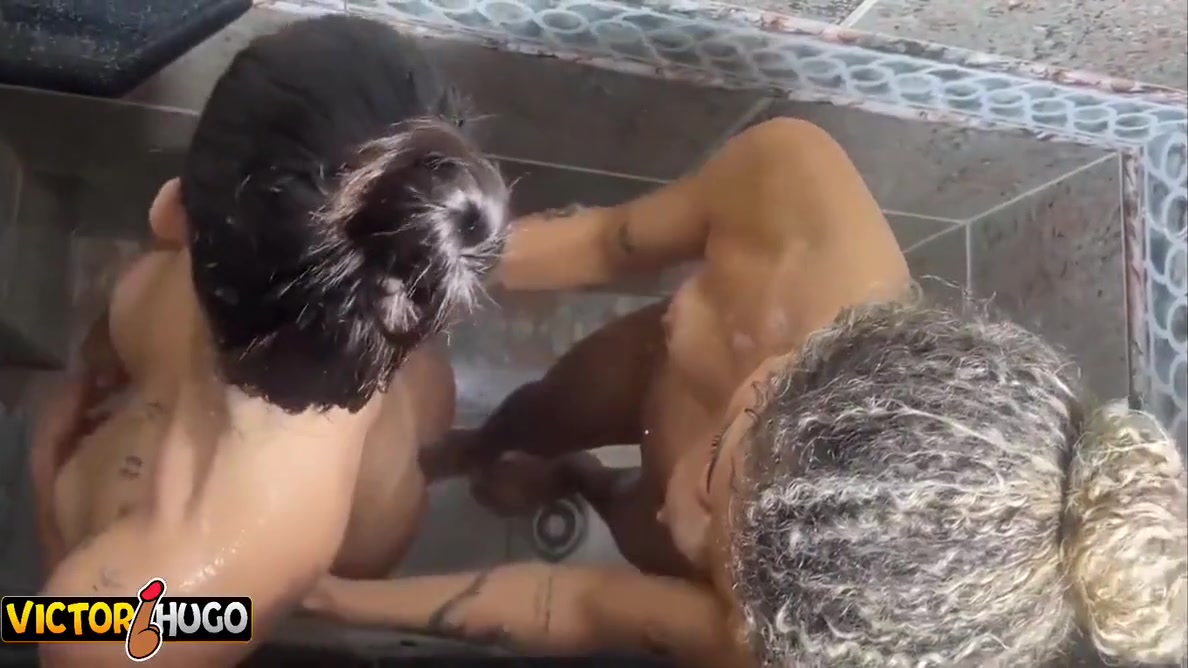 Two Sexual Young Women Enjoying A Hot Shower