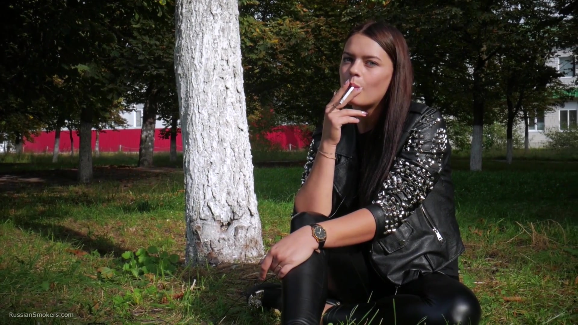 Pretty Faced Asya Is Smoking A Cigarette Outdoors