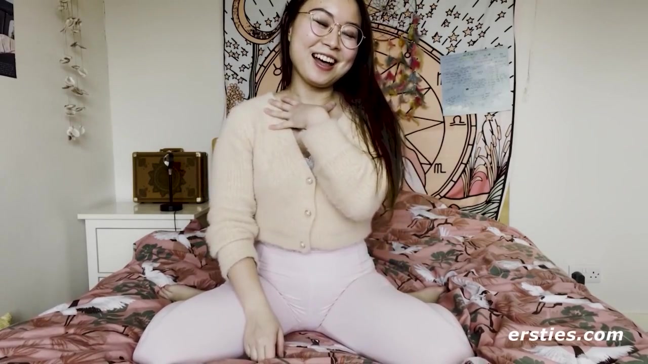 Cute Babe From China Rubs Her Shaved Pussy Before Grabbing A Dildo
