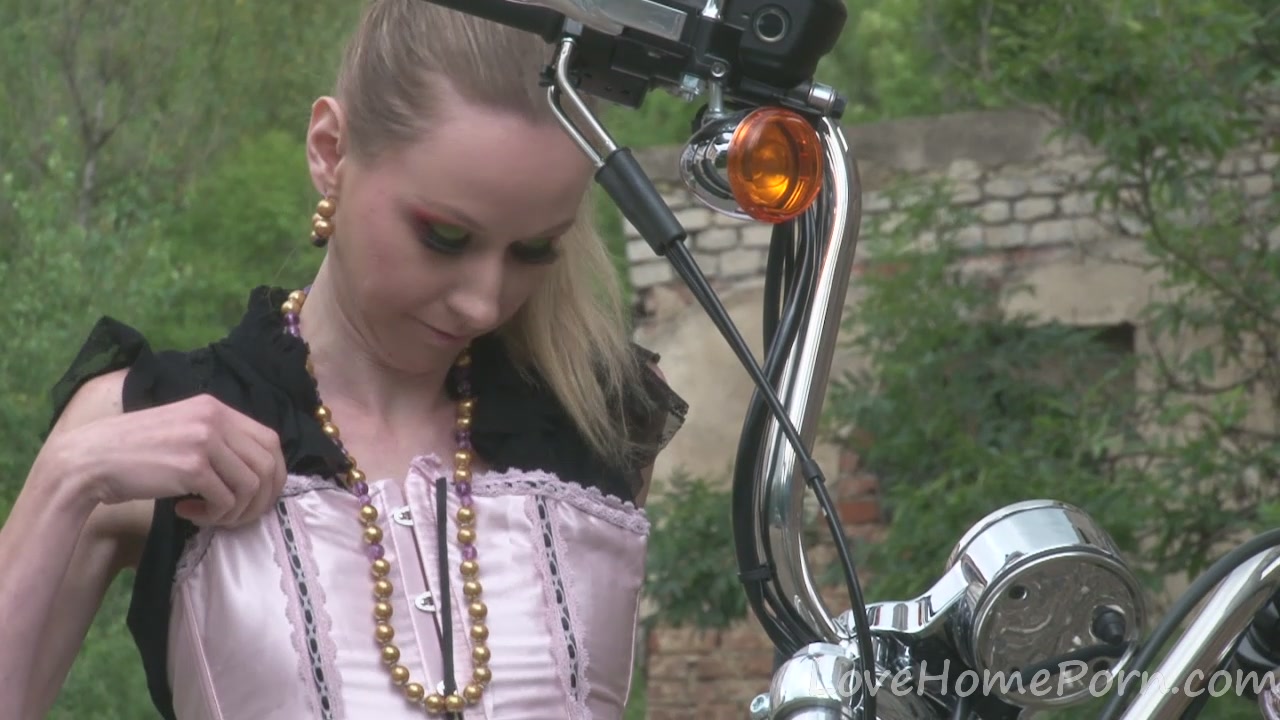 Cute teen 18+ is amazed by a big bike